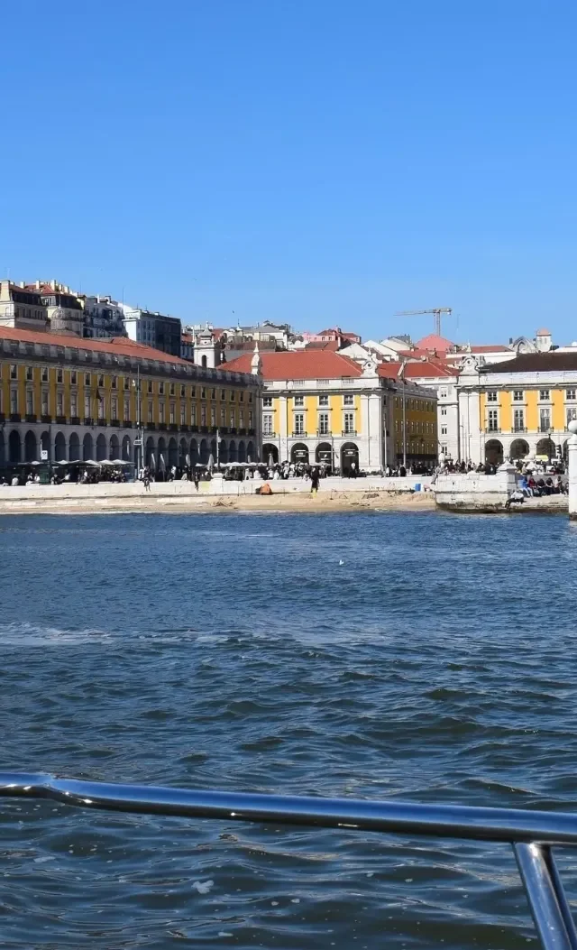 Praça do Comércio and its triumphal arch seen from the bow of the yacht on the Tagus River
