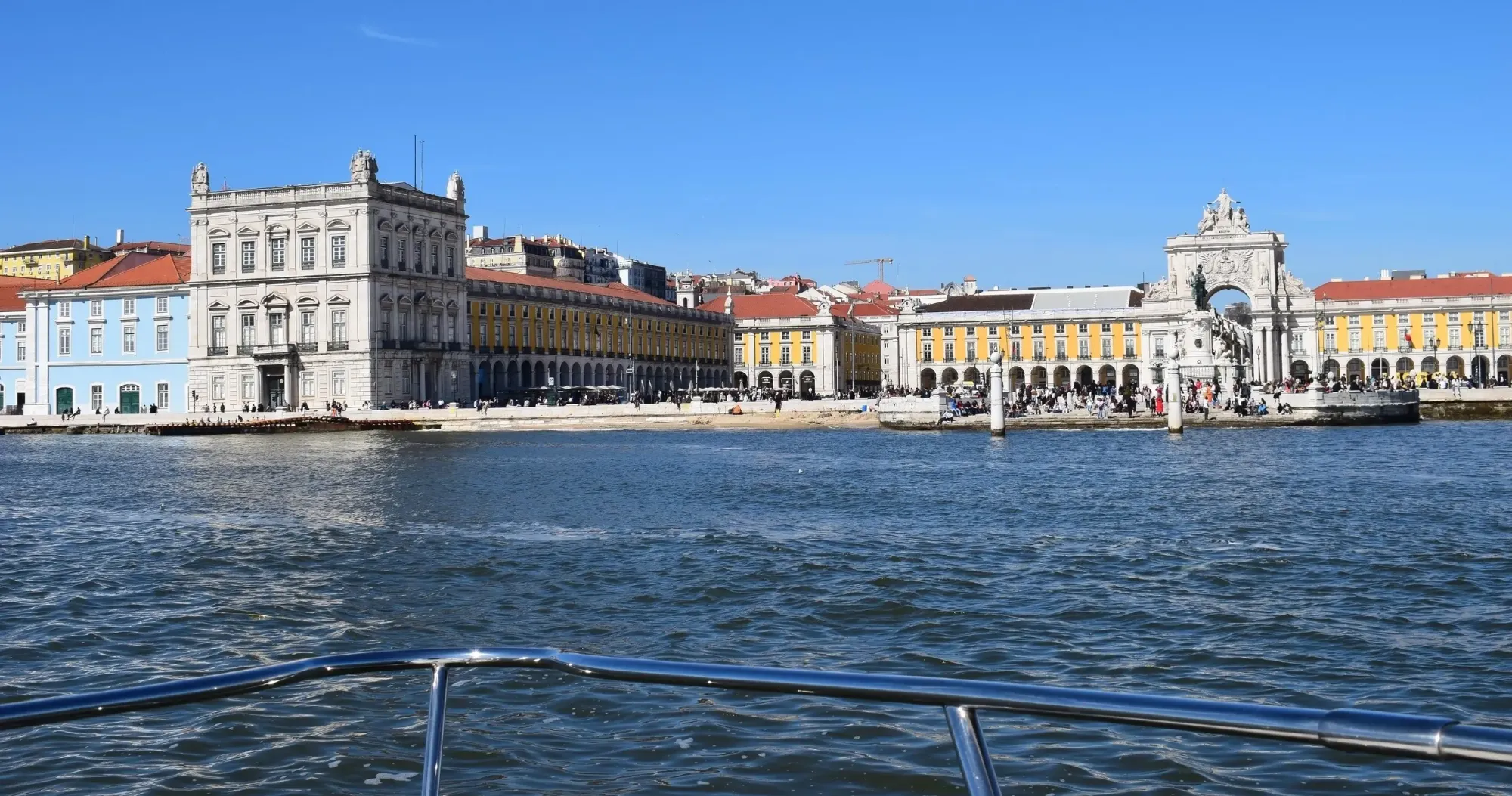 Praça do Comércio and its triumphal arch seen from the bow of the yacht on the Tagus River