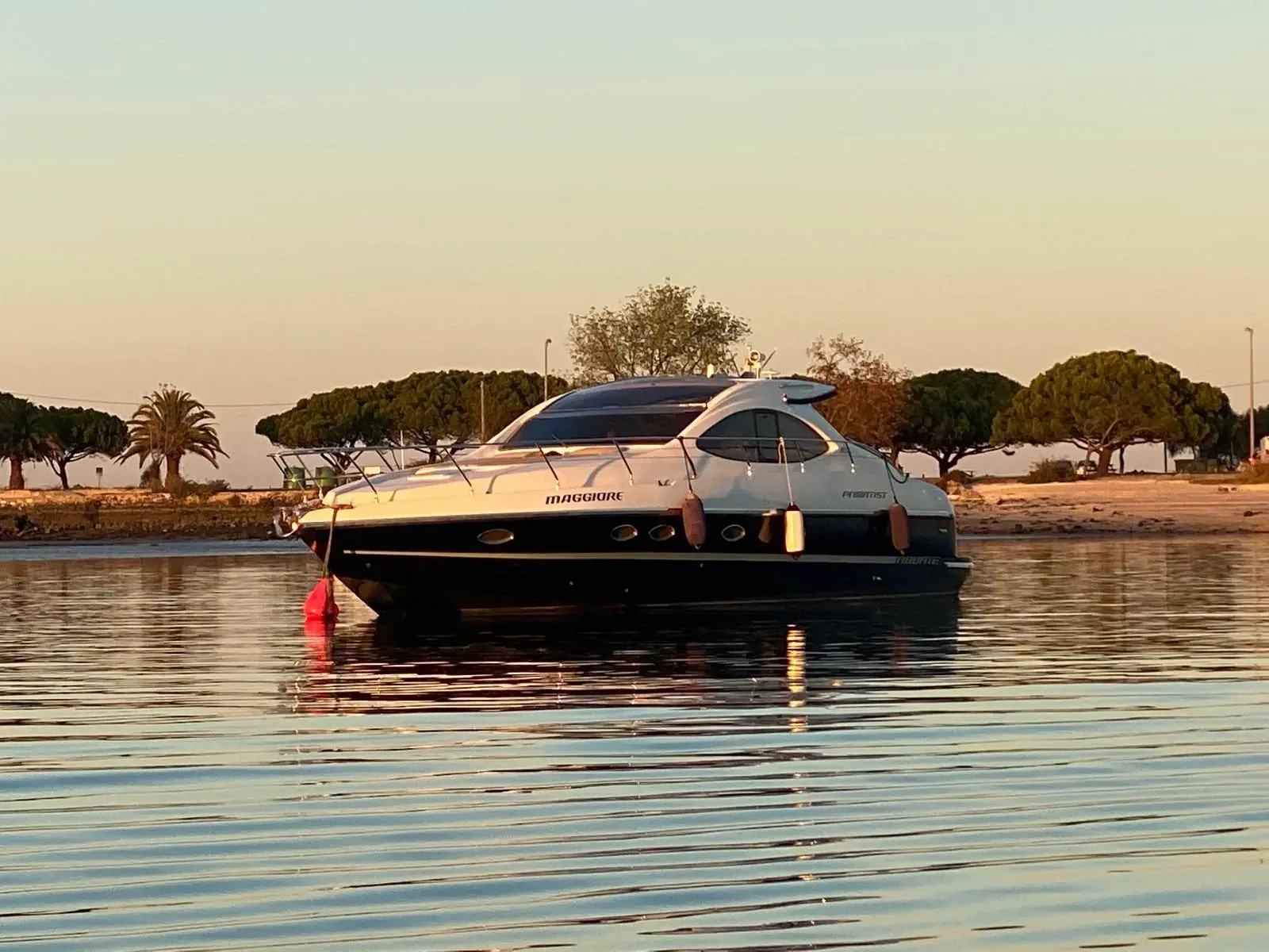 The Primatist yacht anchored on calm water at golden hour