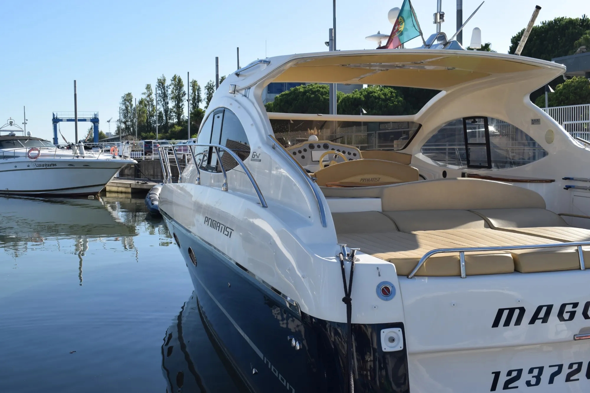 Stern and sun deck of the Primatist G41 moored at the marina
